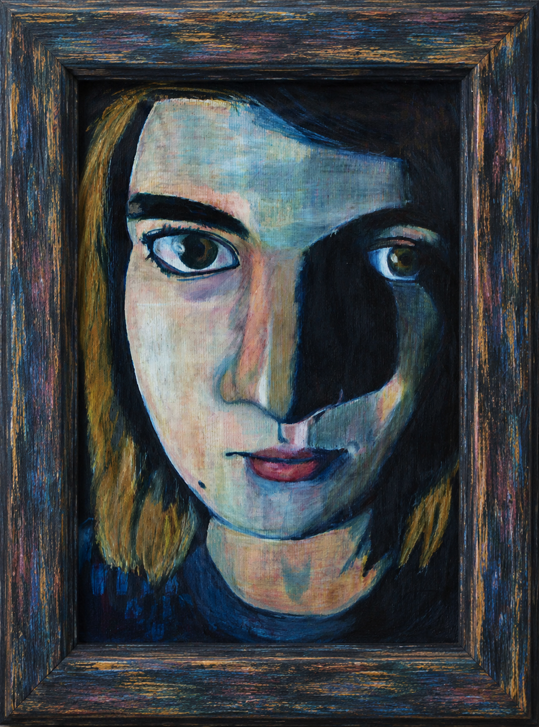 Blue split-face portrait in a frame
